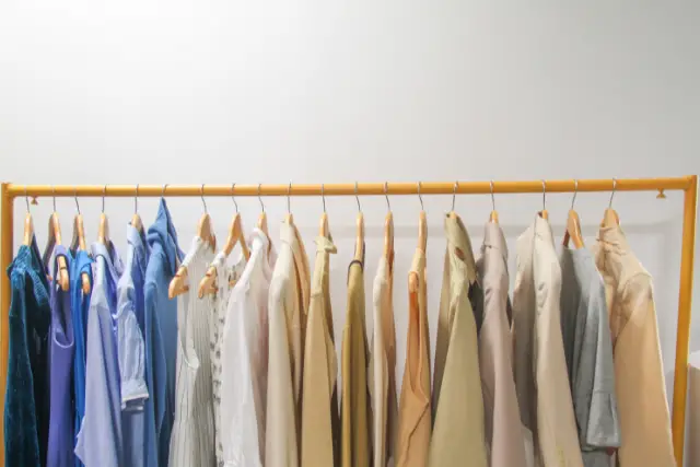 muted color clothes on a rack