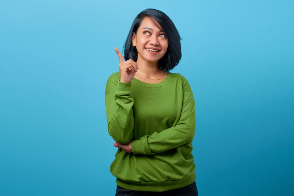 woman wearing olive green sweater