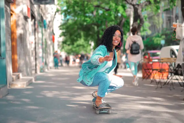 young woman skateboarding - featured image