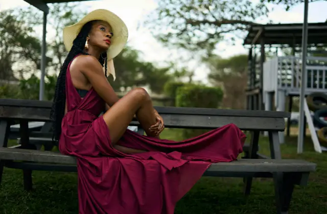 woman in burgundy dress - featured image