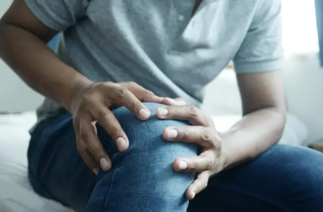 guy on grey shirt and blue jeans