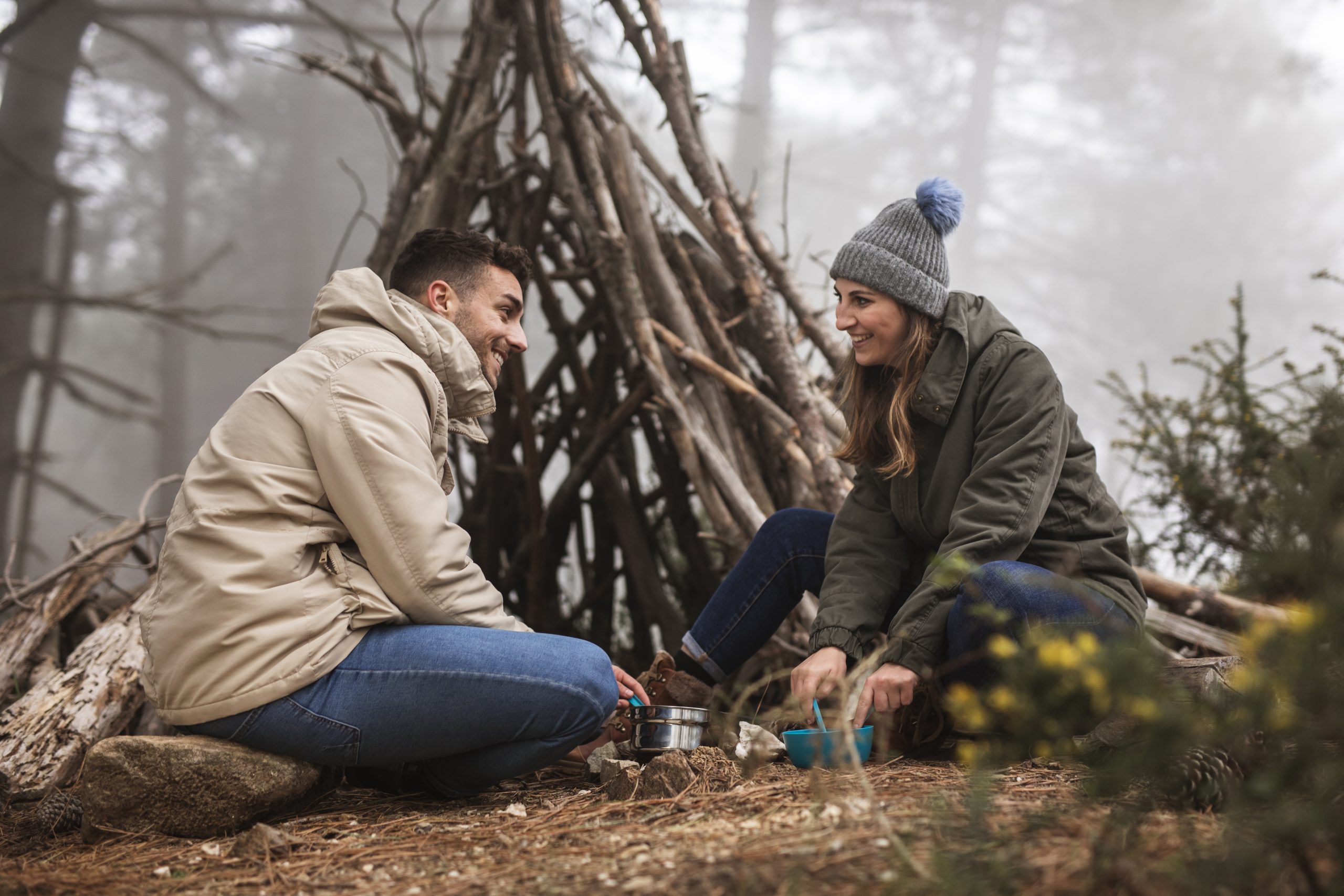 low-angle-people-with-branches-shelter